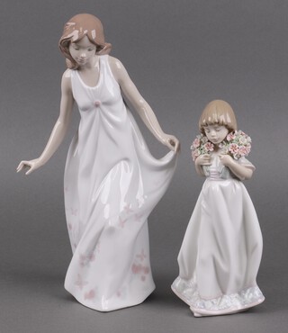 A 1987 Lladro Society figure - Spring Bouquets 7603, base signed and dated 24.11.88 20cm and 1 other Wonderful Mother 7975 28cm, both boxed 