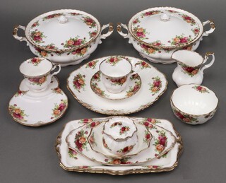 A 92 piece Royal Albert Old Country Rose pattern dinner/tea service comprising 2 vegetable tureens and covers, 6 dinner plates (4 seconds), 14 side plates (10 seconds), 6 smaller side plates (1 rings flat), 15 tea plates (4 seconds), twin handled plate (second), 2 rectangular sandwich plates, oval platter (second), jar and cover, shaped dish, butter dish lid, 8 pudding bowls (all seconds), milk jug, sugar bowl (second), 16 tea cups (3 seconds, 3 ring flat), 14 saucers (2 seconds) and a "tennis" set, together with an Elizabethan pattern twin handled bread plate 