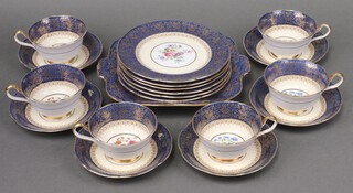 An Aynsley 19 piece gilt and Coalport blue pattern tea service, decorated roses, comprising twin handled plate, 6 tea plates (1 a/f, 2 cracked), 6 cups and 6 saucers, no. B742B 