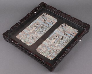 Two 19th Century Chinese rectangular embroidered panels depicting figures 24cm x 10cm, contained in a pierced and carved hardwood frame 