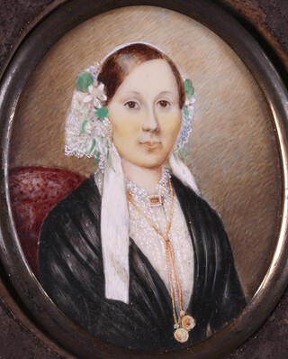 Clara Haller (British 19th Century), Oval Miniature Portrait of a Lady wearing a Lace Bonnet and Shirt, a Black Shawl, and Gold Necklace, watercolour on ivory, signed and dated 1853 verso, 7cm x 5.5cm, within an ebonised wood frame Ivory exemption Certificate S1MKRFC2