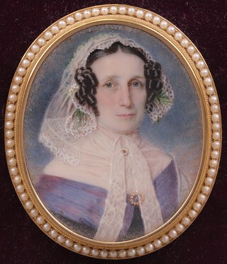 Circle of William Egley (1798-1870), Oval Portrait Miniature of a Lady wearing a White Lace Bonnet and Purple Silk Dress, watercolour on ivory, 6cm x 5cm, within a gold and pearl frame. Ivory Exemption Certificate T8D372YR