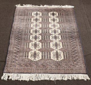 A blue and white Bukhara rug 182cm x 127cm 