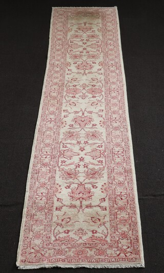 A white and red ground, floral patterned Ziegler runner 407cm l x 81cm w 