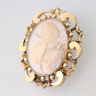 A 19th Century pinchbeck mourning brooch with woven hair panel to back and front (pin a/f) 5cm