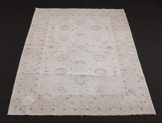 A white and red ground floral patterned Ziegler rug 285cm x 183cm 