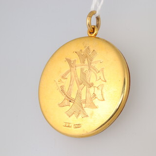 A 15ct gold locket, monogrammed (glass a/f), gross weight 11.5g 