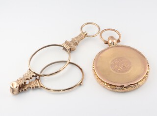 A gilt metal oval locket with engine turned decoration (hinge a/f), together with a pair of gilt metal lorgnettes 