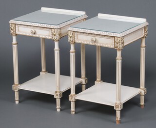 A pair of Louis style white painted bedside tables with raised backs, fitted drawers, raised on turned and fluted supports 68cm h x 45cm w x 43cm d 