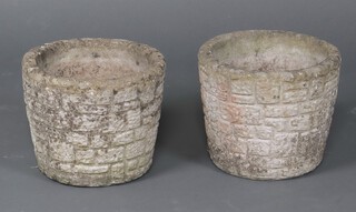 A pair of well weathered circular concrete garden urns 27cm h x 31cm diam.  