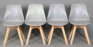 A set of 4 mid-century tulip style dining chairs 