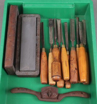 An oil stone, a spoke shave and a collection of chisels