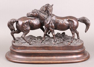 A bronzed resin figure group of 2 standing horses on an oval base 32cm h x 50cm w x 27cm d (slight cracks around one of the horses neck)