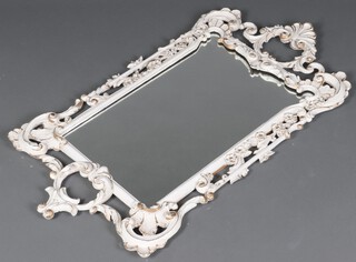 A rectangular plate mirror contained in a white and gilt painted frame 103cm h x 56cm w (old repair to crest) 