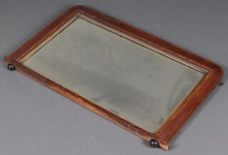 An Edwardian rectangular mahogany over mantel mirror contained in an inlaid mahogany frame 53cm h x 89cm w 