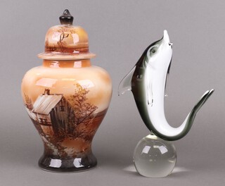 A Murano style glass figure of a dolphin 30cm, together with a pottery urn and cover decorated a cottage 34cm h 