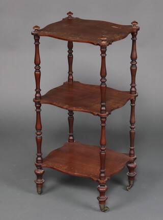 A Victorian shaped mahogany 3 tier what-not on brass casters 79cm h x 38cm w x 32cm d (water and contact marks in places)