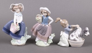 Three Lladro figures - Pretty Picking 5222, Bashful Bather 5455 and Sweet Scent 5221