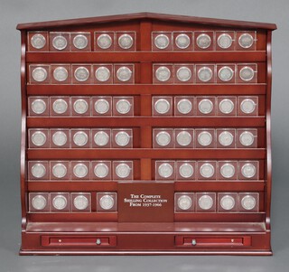 A complete set of shillings from 1936 to 1966, slabbed and mounted in a mahogany 6 tier shelf 50cm h x 55cm w x 14cm d 