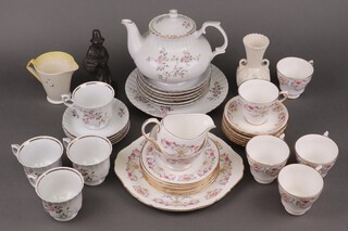 A 17 piece Czechoslovakia Royal pattern tea service comprising bread plate, 6 tea plates, 4 cups (1 chipped and cracked), 5 saucers, teapot, together with a 21 piece Coalclough Queen Anne pattern tea service with bread plate, 6 tea plates, milk jug, sugar bowl, 5 cups, 7 saucers, a Beswick twin handed vase, an Art Deco style vase etc  