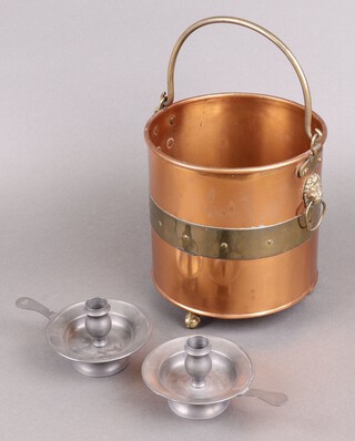 A pair of pewter chamber sticks together with a copper and brass pail with swing handle 