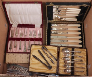 A set of glass place mats, 6 fish knives and forks, 6 tea knives, 6 pastry forks and servers, 12 silver plated apostle spoons, 2 pairs of nut crackers, a fish slice and fork