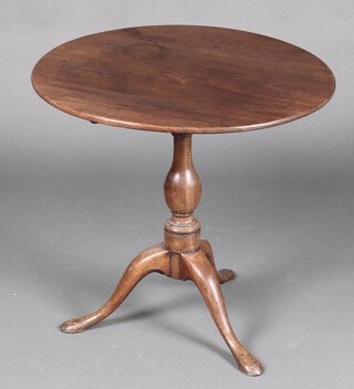 A 19th Century circular mahogany snap top wine table, raised on pillar and tripod base 65cm h x 69cm diam. 