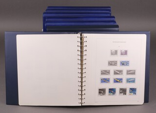 Seven blue albums of German stamps 