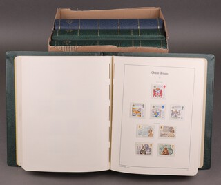 Three green and 1 blue album of Elizabeth II GB mint stamps 