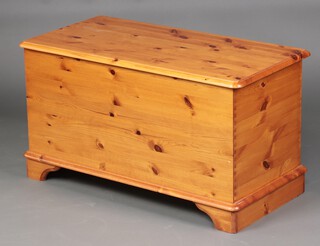 A pine coffer with hinged lid on bracket feet 53cm h x 96cm w x 38cm d