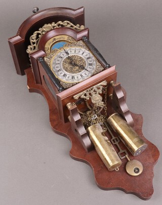 A reproduction protestant wall clock complete with pendulum and weights