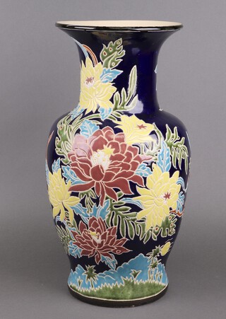 An Oriental blue glazed club shaped floral patterned vase 50cm 
