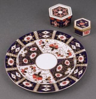 A Royal Crown Derby trinket box and cover, the base marked 1297 XLIX 4cm h x 6cm, 1 other A.1295 L 3cm x 5cm and a Derby style plate 18cm 