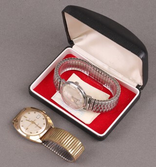 A gentleman's Timex automatic wristwatch with calendar aperture in a gilt case together with a Consul wristwatch in a chrome case 