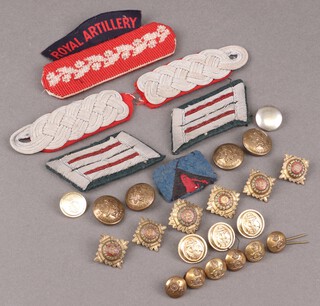 Two German epaulettes and a small collection of cloth and metal insignia 