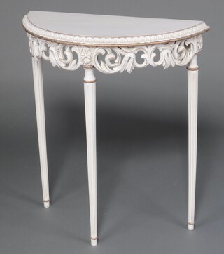 A white and gilt painted Louis style demi-lune table on turned and fluted supports 80cm h x 71cm w x 31cm d
