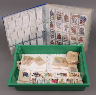 A ring bound album containing various cigarette cards - Players, Wills and a collection of Kensitas loose cigarette cards 