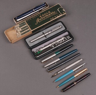 A blue Parker Junior fountain pen boxed, a small Parker Duofold fountain pen in a red marbled case, a Parker fountain pen and a Sheaffer fountain pen, a dip pen, propelling pencil etc 