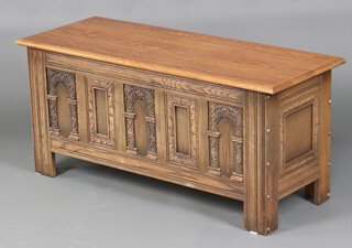 An Old Charm carved oak coffer with hinged lid 52cm h x 114cm w x 44cm d 