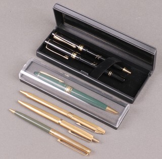 A Papermate propelling pencil in gilt and grey case, 2 gilt cased ballpoint pens and a small collection of pens 
