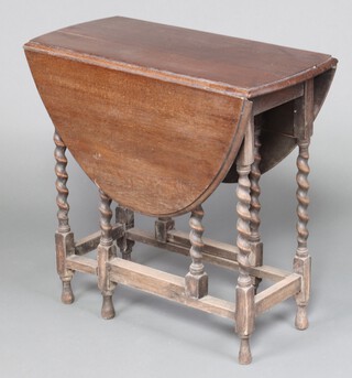 A 1930's oak oval gateleg tea table on spiral turned supports 72cm h x 73cm w 