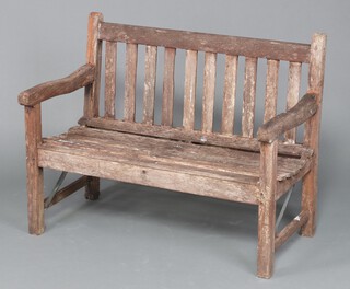 A wooden slatted garden bench 82cm high x 93cm w 