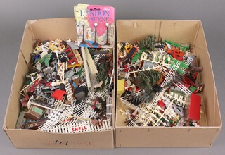 A collection of O gauge fencing, figures, model cars etc, contained in 2 shallow boxes 