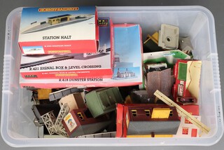 A Hornby R421 signal box, an R418 Dunster Station and a R590 Station, all boxed, together with a collection of Hornby rails and buildings, contained in a large plastic box 