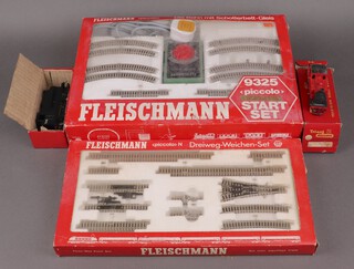 A Fleischmann N gauge 9325 train set boxed, together with a 9194 set boxed, a Triang OO gauge 153 tank engine boxed and 1 other R555R boxed 