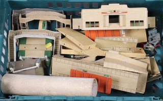 A Hornby Dublo metal station platform together with level crossings, foot bridges, etc, contained in a green plastic box 