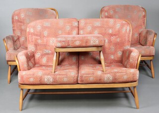 An Ercol beech framed 2 seat settee, 2 matching armchairs and a footstool, upholstered in orange coloured material (some stains to material) 