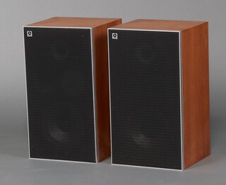 A pair of LEAK 2030 speakers in teak cases