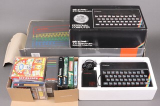 A vintage rubber keyed ZX Spectrum, boxed with fitted polystyrene, complete, a ZX Spectrum Plus 2, boxed with polystyrene, complete and various games and joy sticks