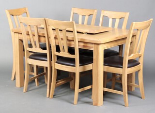 A light oak dining suite comprising rectangular extending dining table with 1 extra leaf 77cm h x 140cm l x 90cm w together with 6 dining chairs (some wear to seats)  